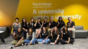 Group of ASU students in front of gold background