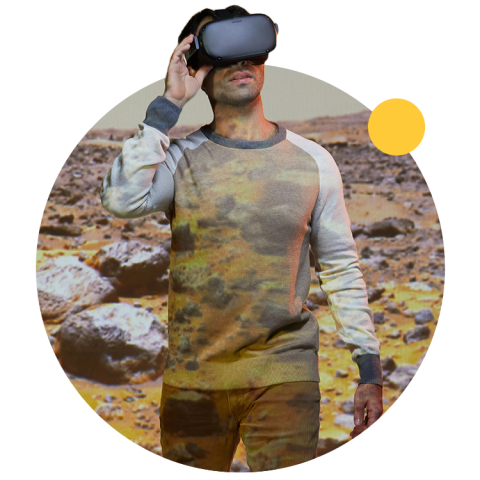 An ASU student uses VR to explore a desert environment.