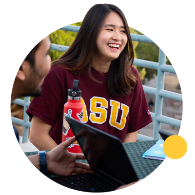 ASU student visits with classmates outside.