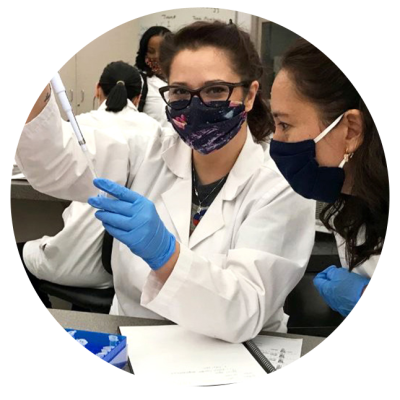Two students working in a lab.